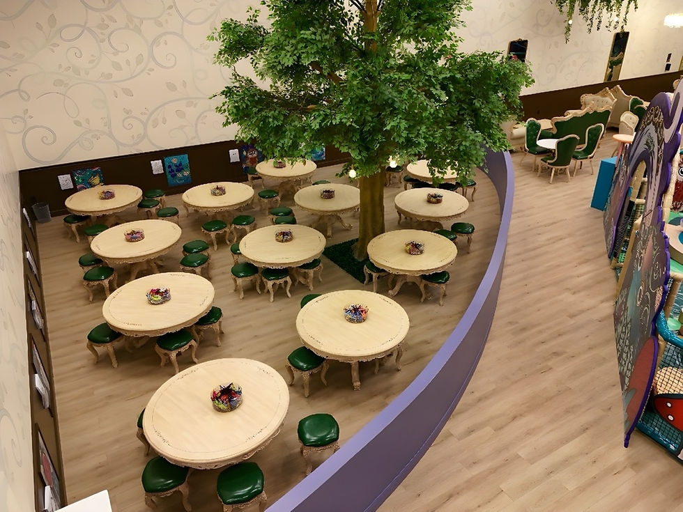Cozy dining area with seating for parents and kids at Kidcadia.